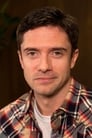 Topher Grace isEddie Brock / Venom