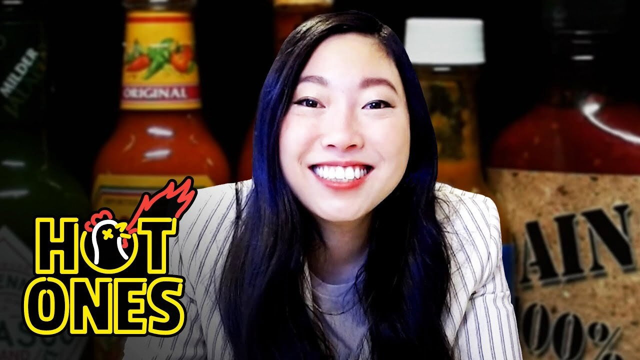 A still from Awkwafina Gets Hot and Cold While Eating Spicy Wings