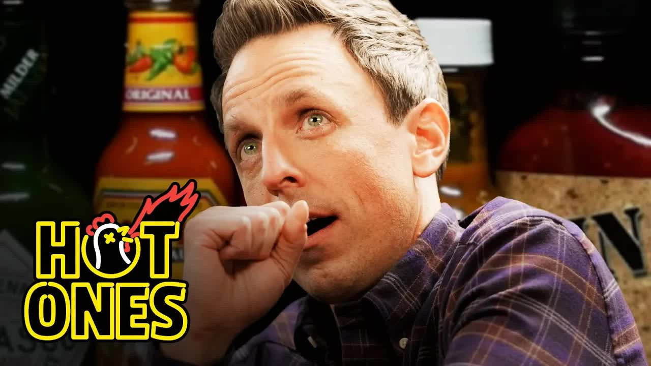 A still from Seth Meyers Unravels While Eating Spicy Wings
