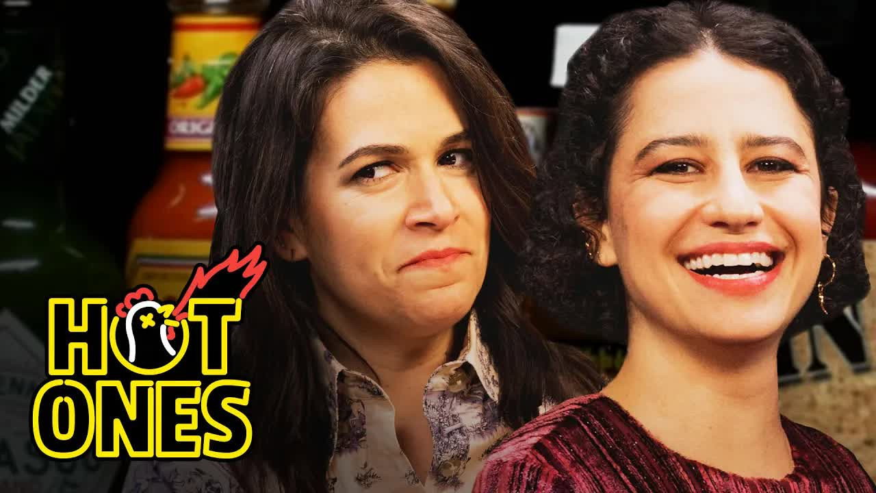 A still from Abbi and Ilana of Broad City Go Numb While Eating Spicy Wings