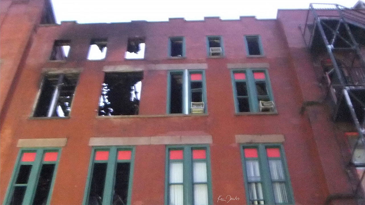 Backdrop image for movie Brick Building with Red and Green Windows