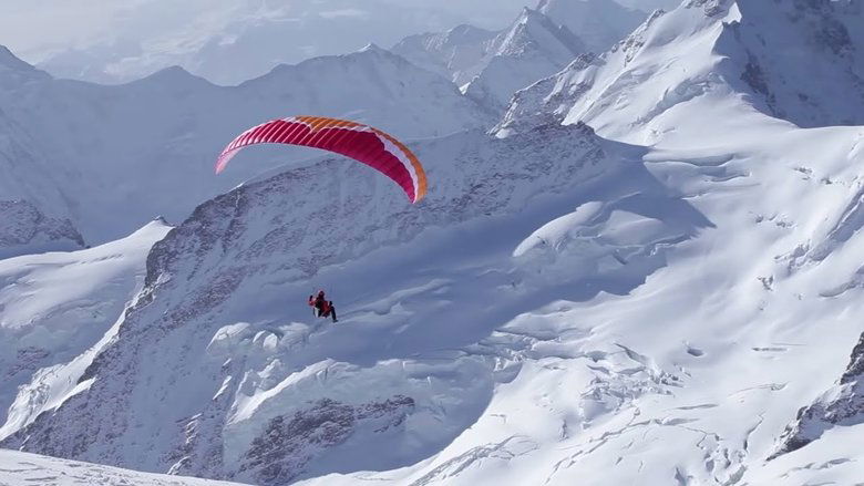 Backdrop image for movie Ueli Steck - Paraglides Between Mountains In The Swiss Alps