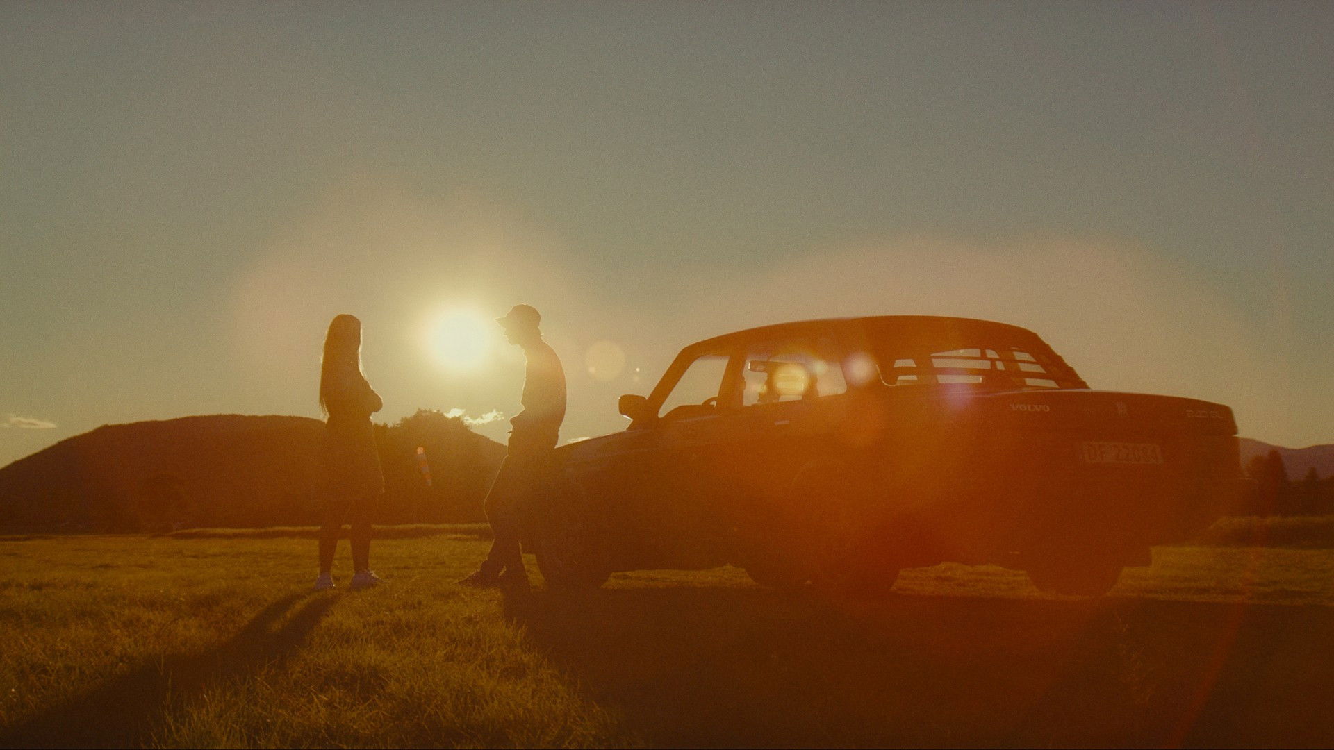 Two drivers at sunset