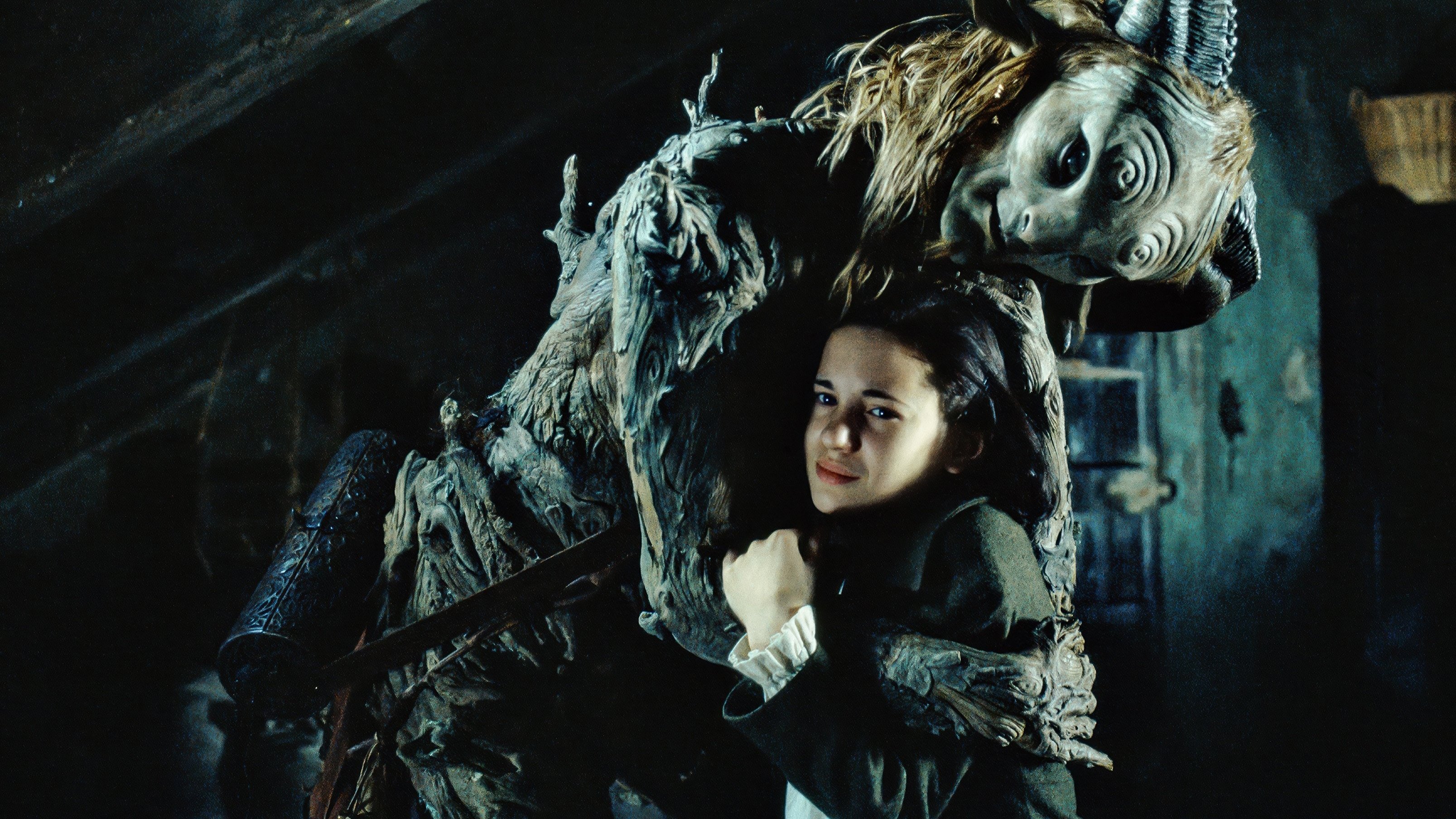 Caption: a woman standing next to a creature in a dark room
