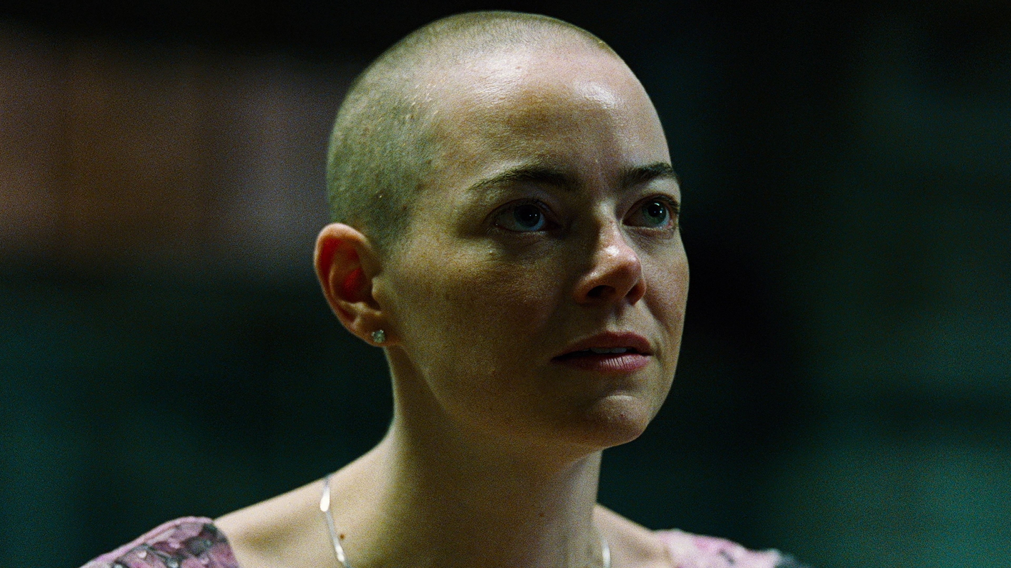 Caption: a close up of a person wearing a necklace