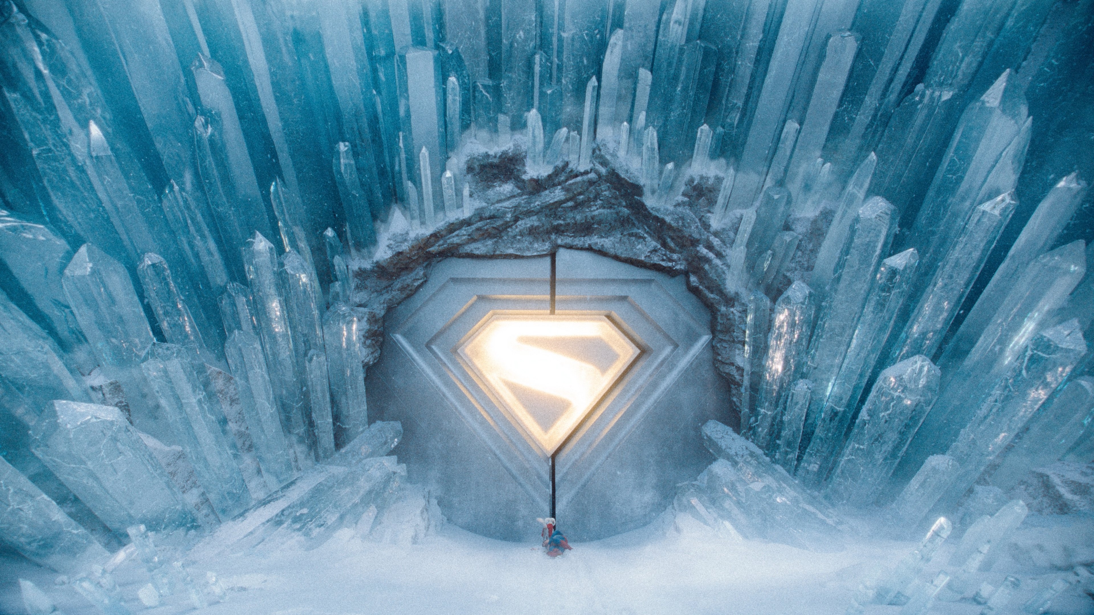 Caption: a man standing in front of a giant ice cave