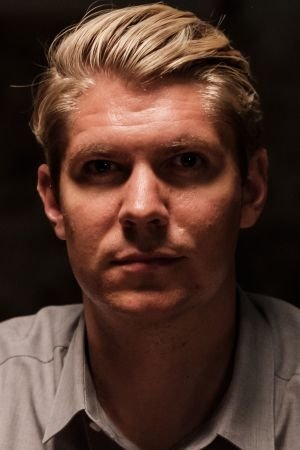 James Ellis as Psycho Ward Guard #1