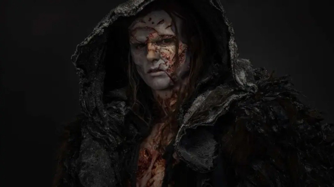 Caption: a man in a hooded coat with blood on his face