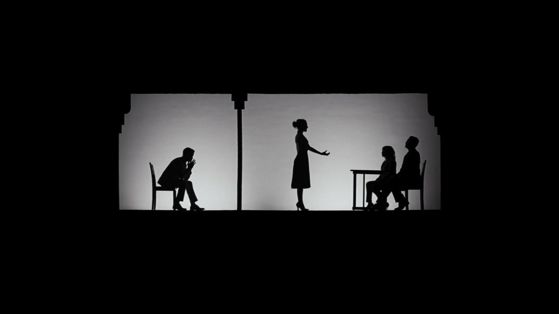 Caption: a couple of people that are sitting in a chair