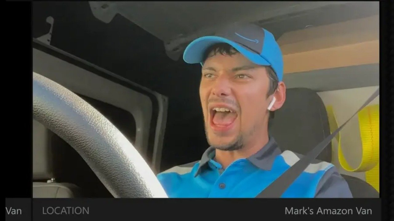 Caption: a man wearing a blue hat driving a car