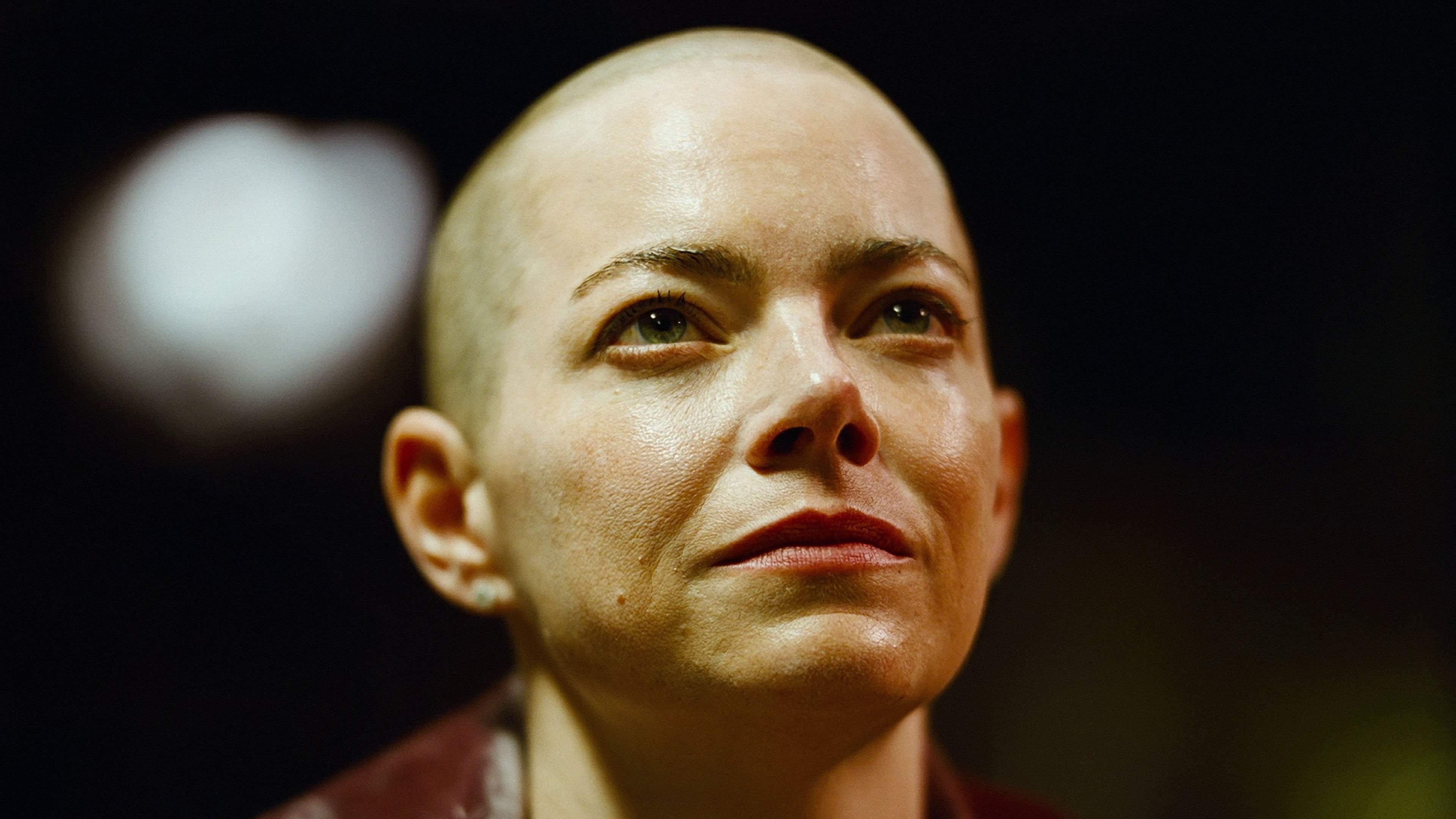 Caption: a close up of a person with a bald head