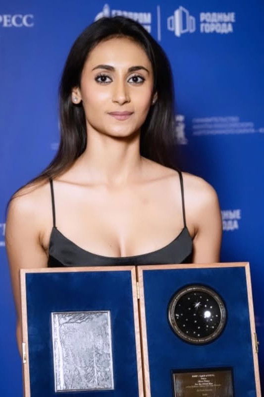 Tanaya Khan Jha backdrop