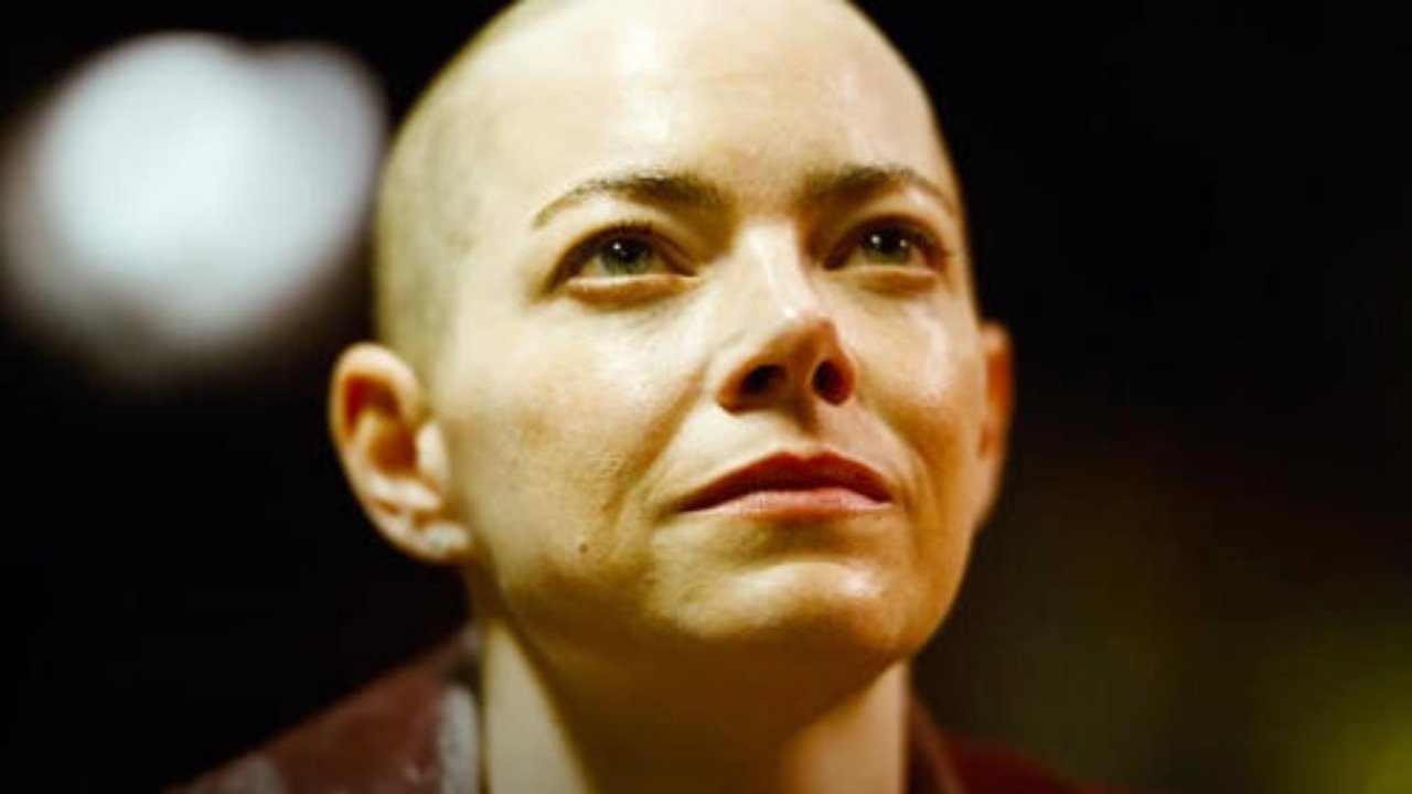 Caption: a close up of a person with a bald head