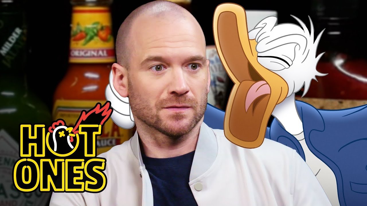 Donald Duck Tries to Keep His Cool While Eating Spicy Wings