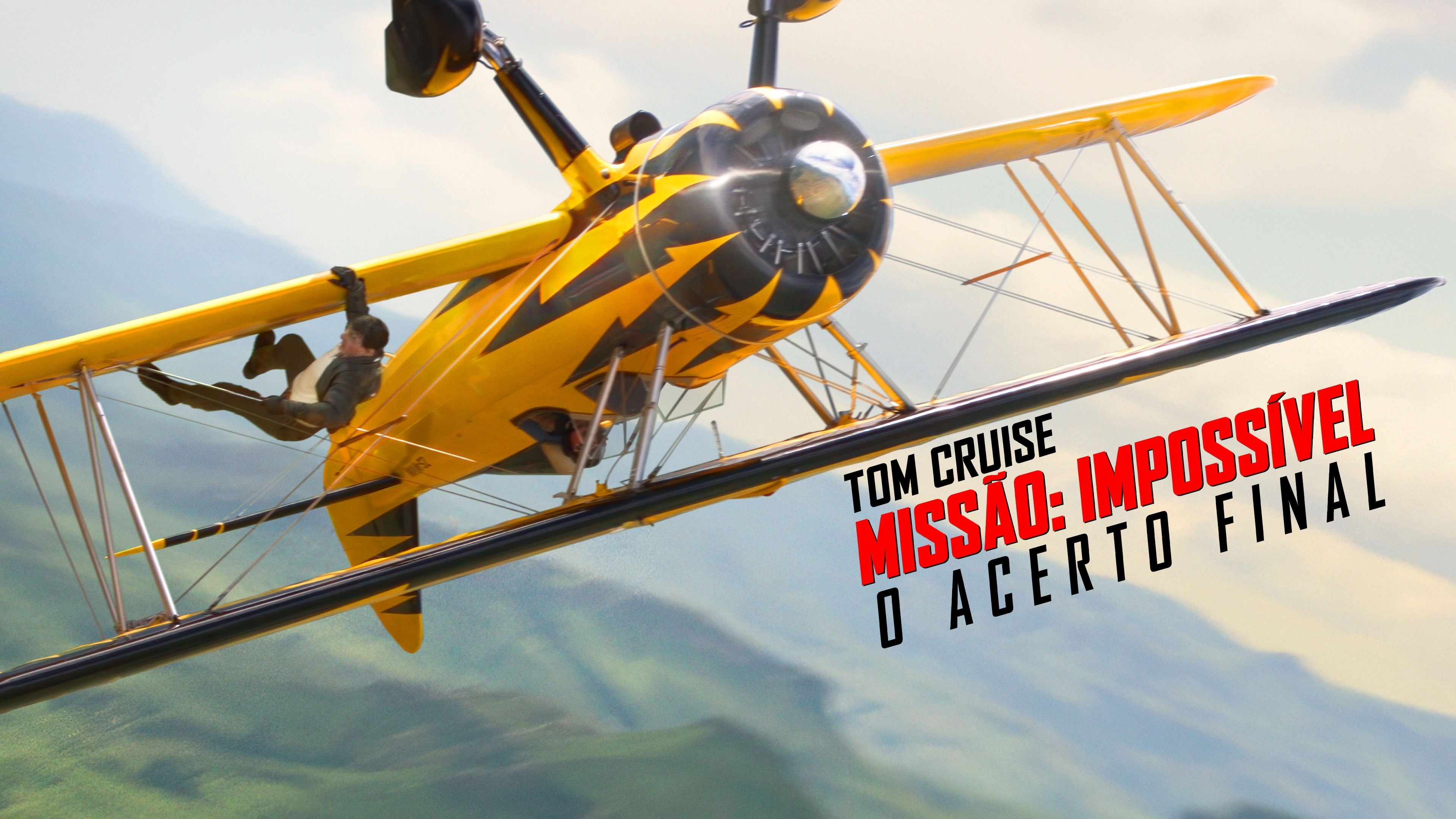 Caption: a yellow and black airplane flying over a mountain