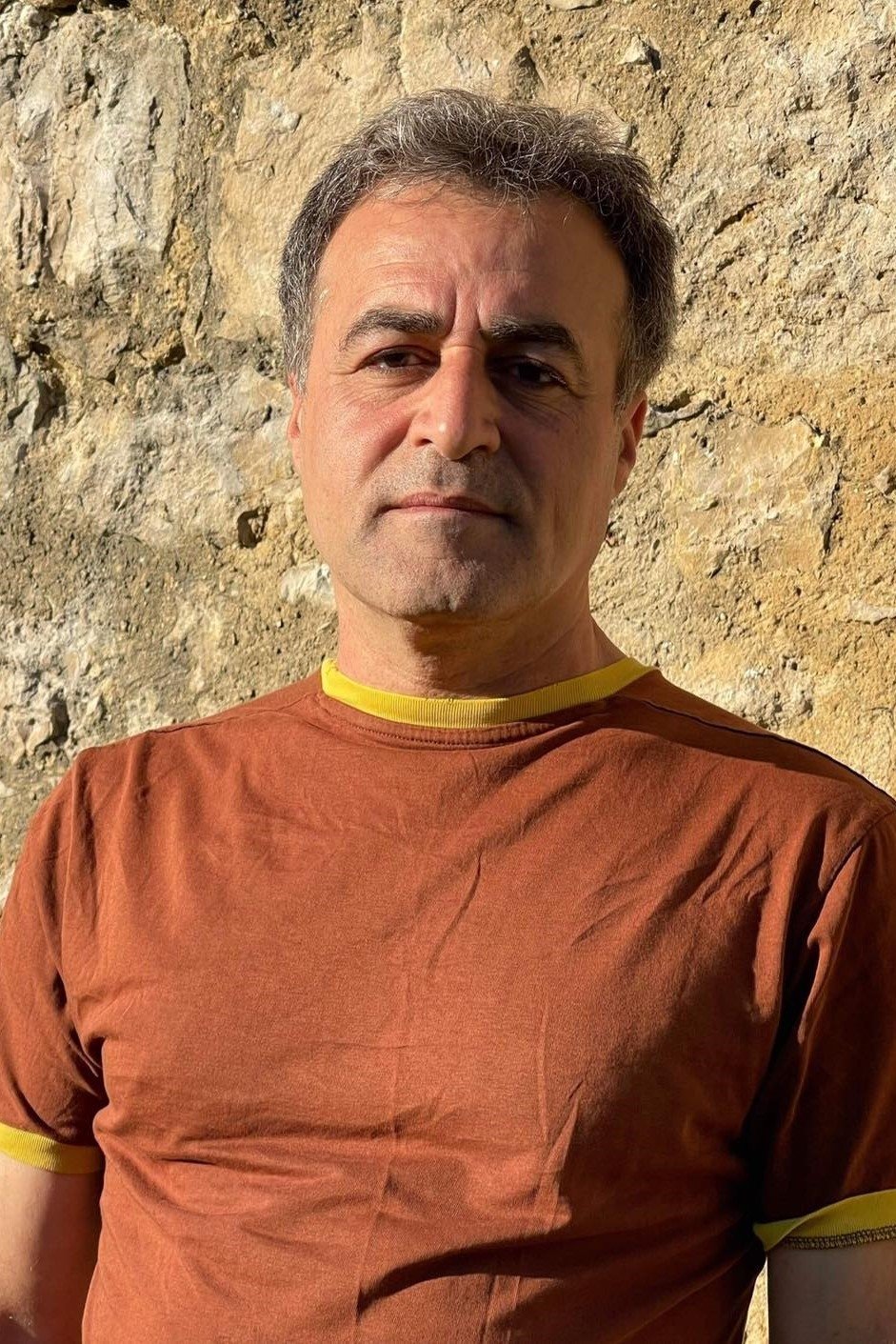 Sarkaw Hadi Ayze as The Tunisian translator
