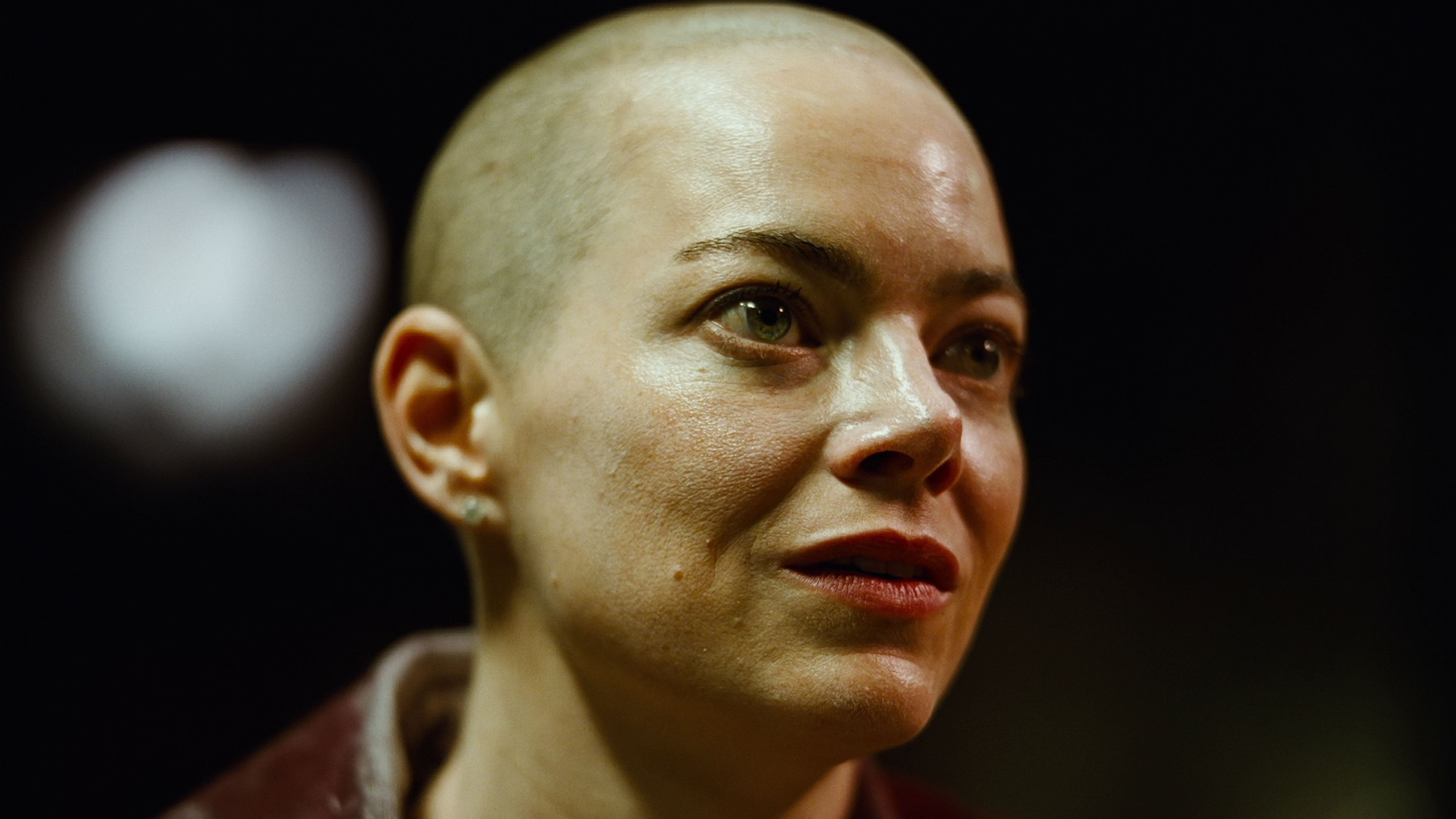 Caption: a close up of a person with a bald head