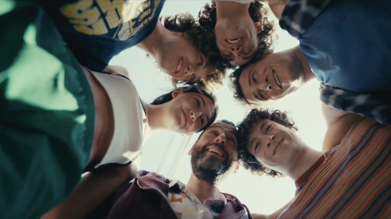 Caption: a group of young men standing in a circle