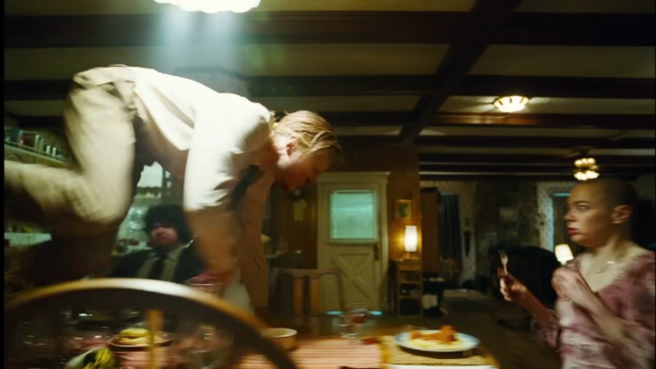 Caption: a group of people standing around a table with food on it