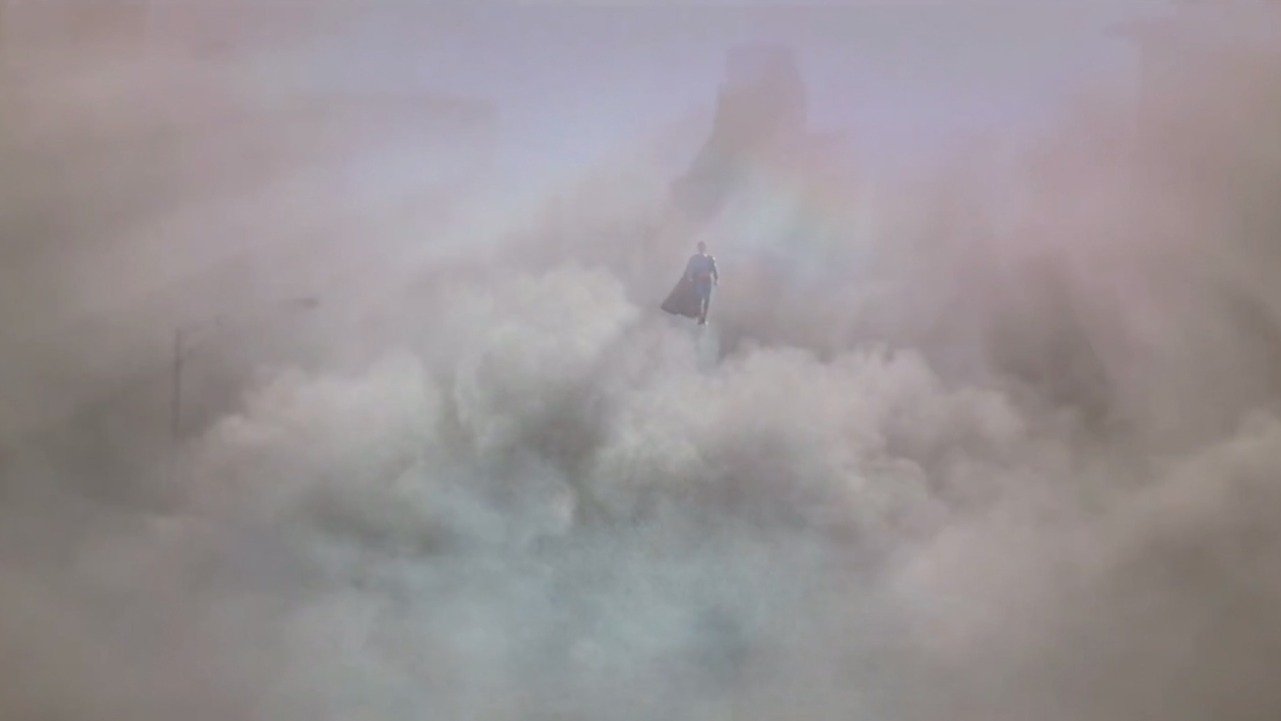 Caption: a plane is flying through the clouds in the sky