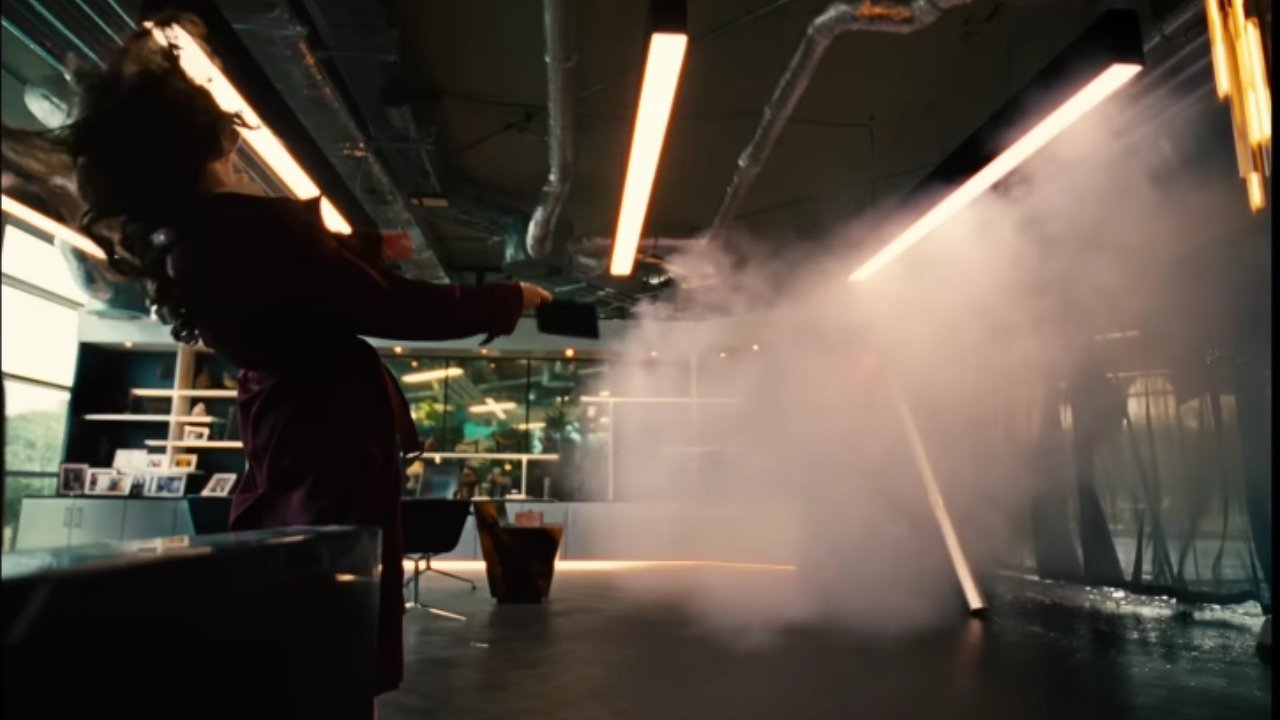 Caption: a person is spraying water on a floor