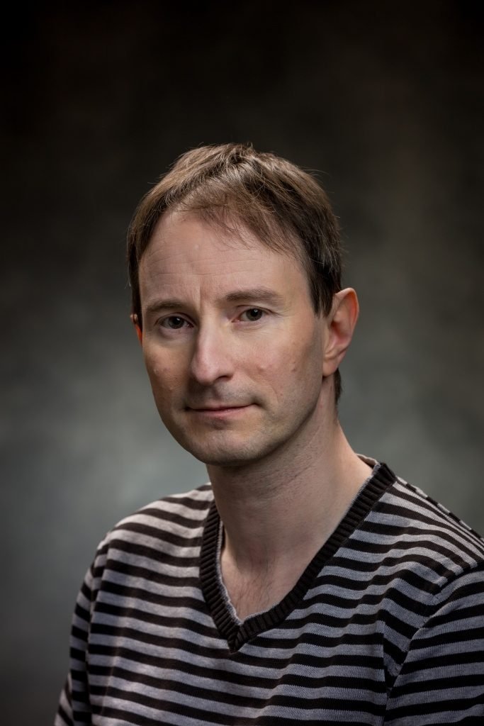 Aron Wade's picture in the cast
