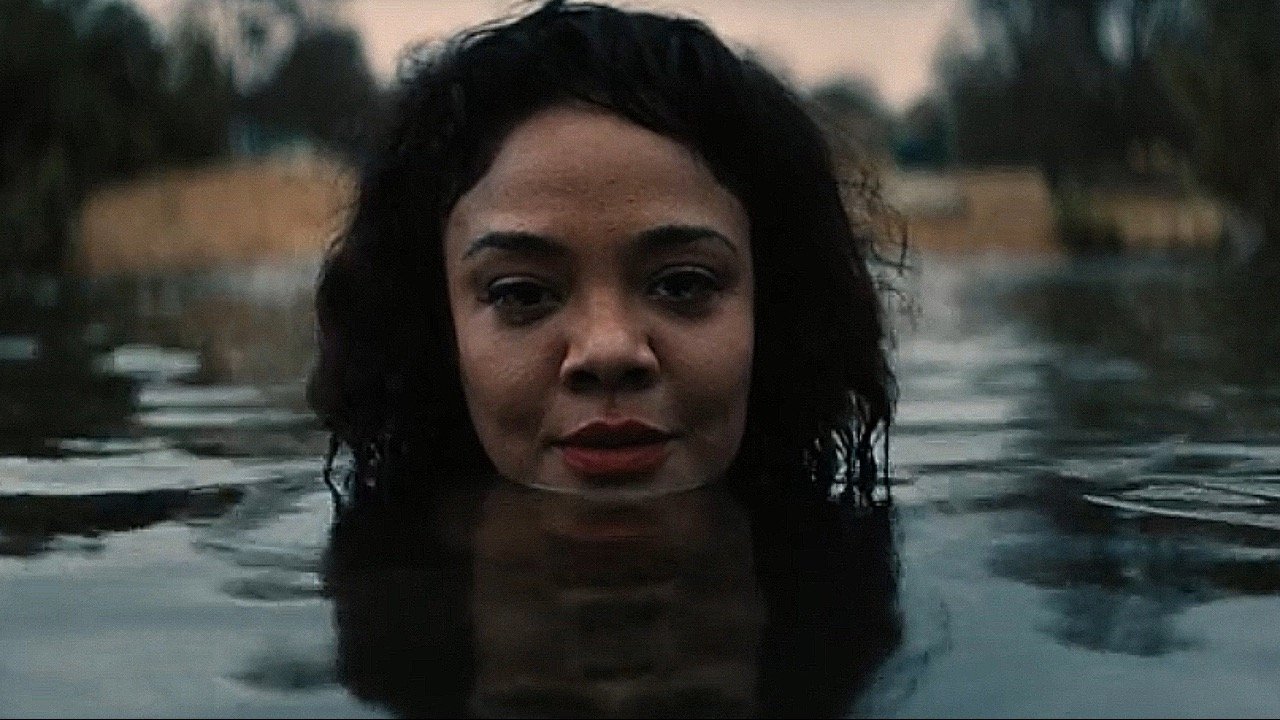 Caption: a woman is submerged in a body of water