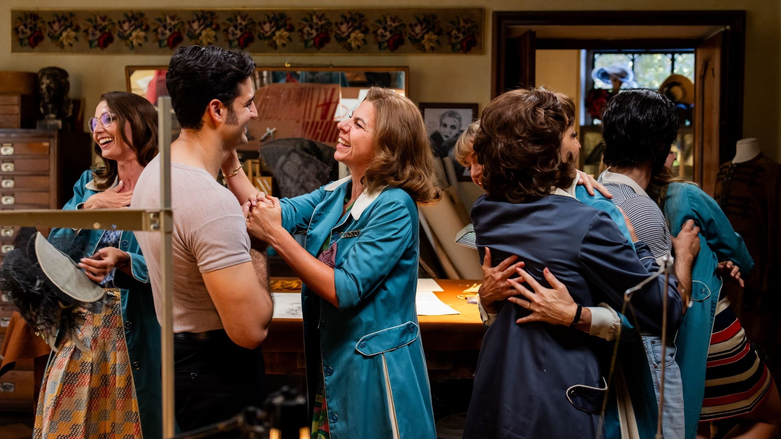 Caption: a group of people standing around each other