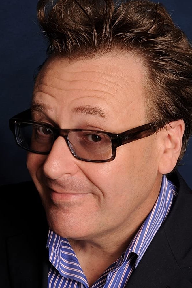 Profile Greg Proops with character Bob the Builder (voice)