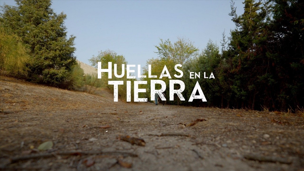 Huellas en la tierra Background