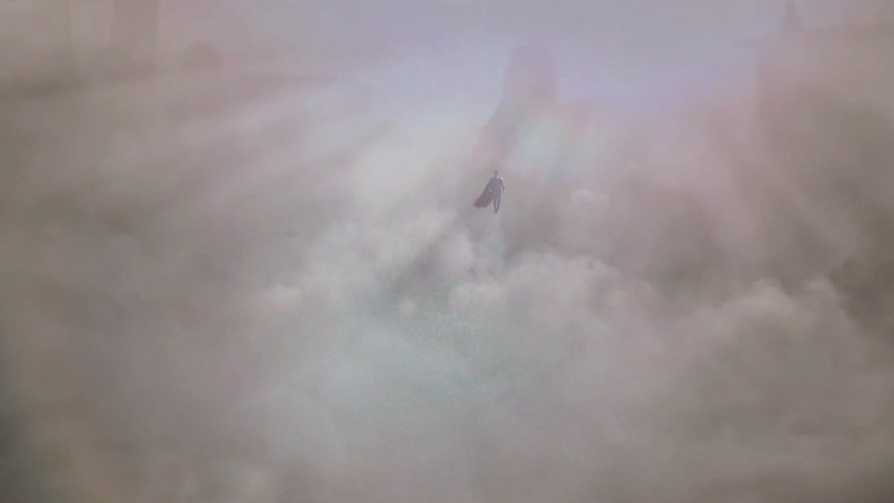 Caption: a plane flying through the clouds in the sky