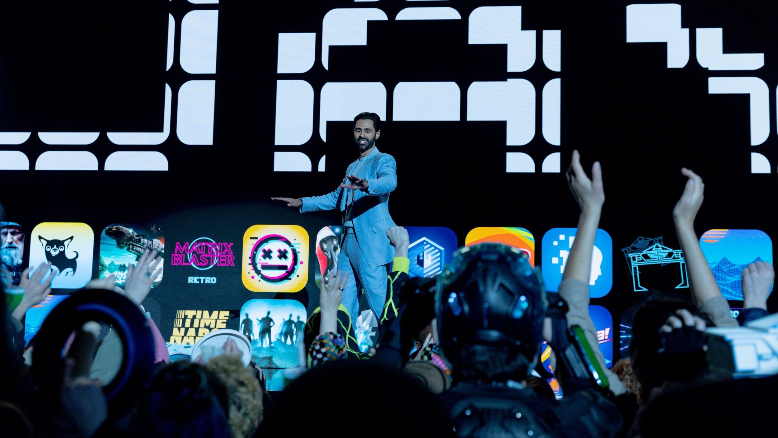 Caption: a man standing on top of a stage holding a microphone