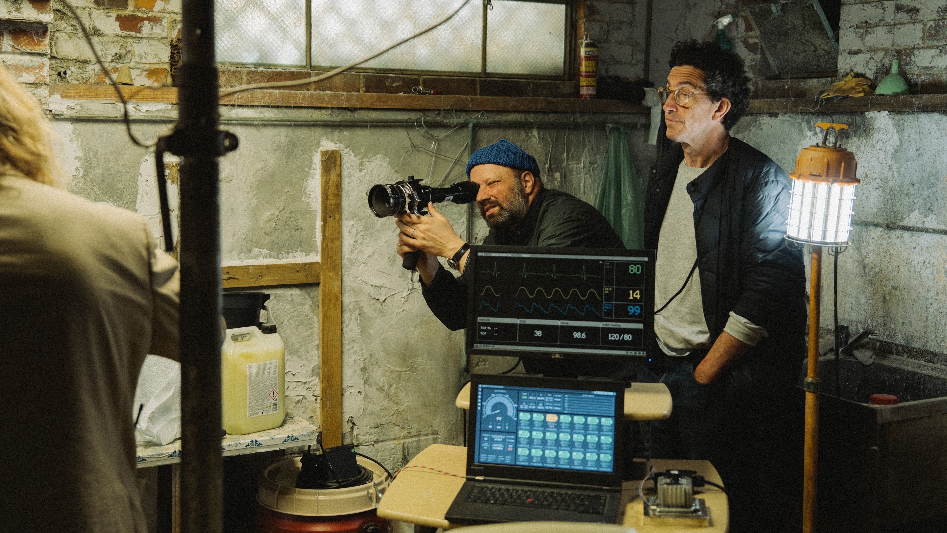 Caption: a man is filming another man with a camera