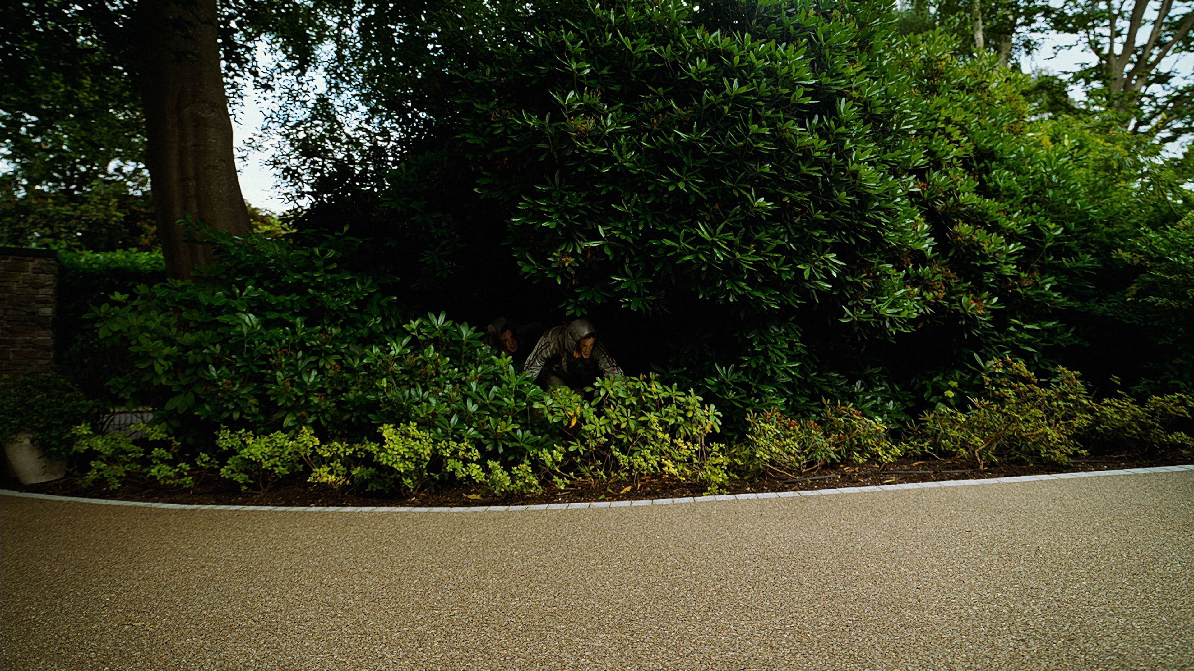 Caption: a man riding a skateboard down a curvy road