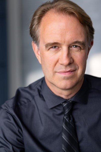 Trevor Black's picture in the cast