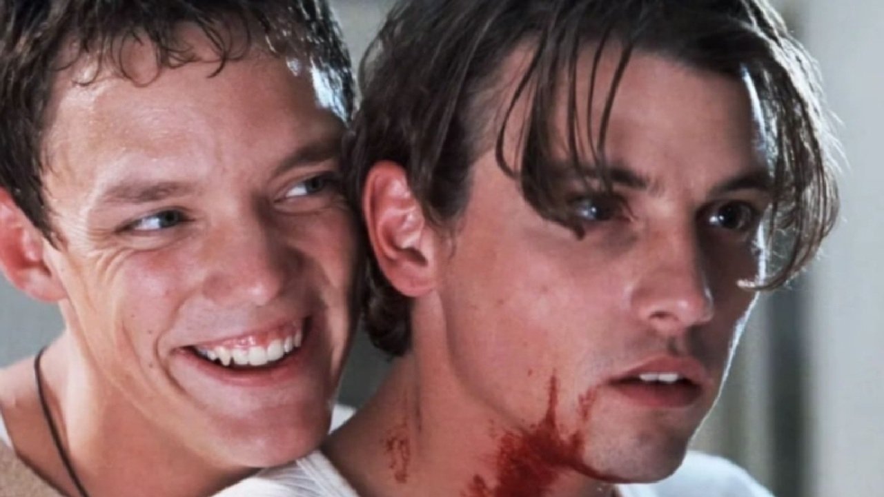 Caption: a couple of men standing next to each other