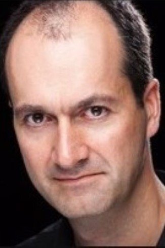 Nick Ball as Grey Suited Man