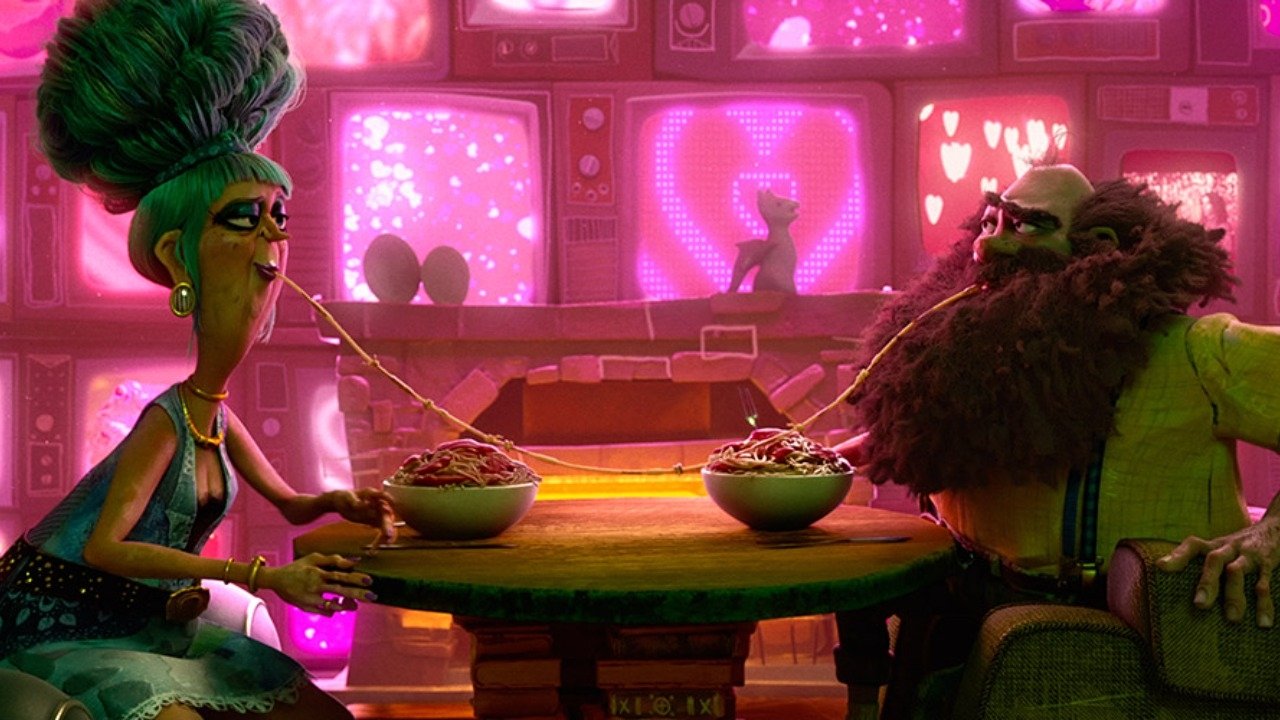 Caption: a man and woman sitting at a table with bowls of food in front of them