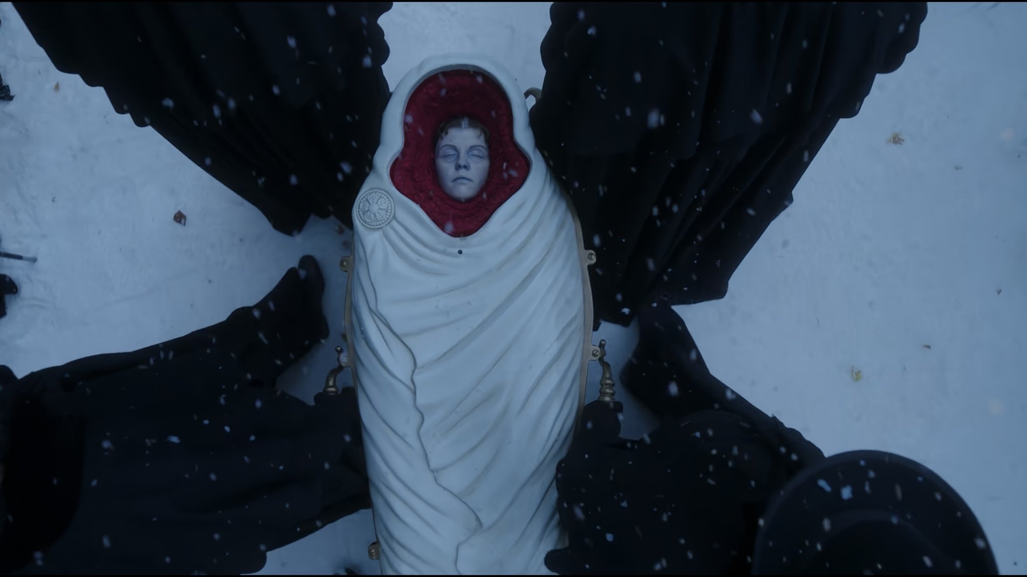 Caption: a statue of a woman wrapped in a blanket