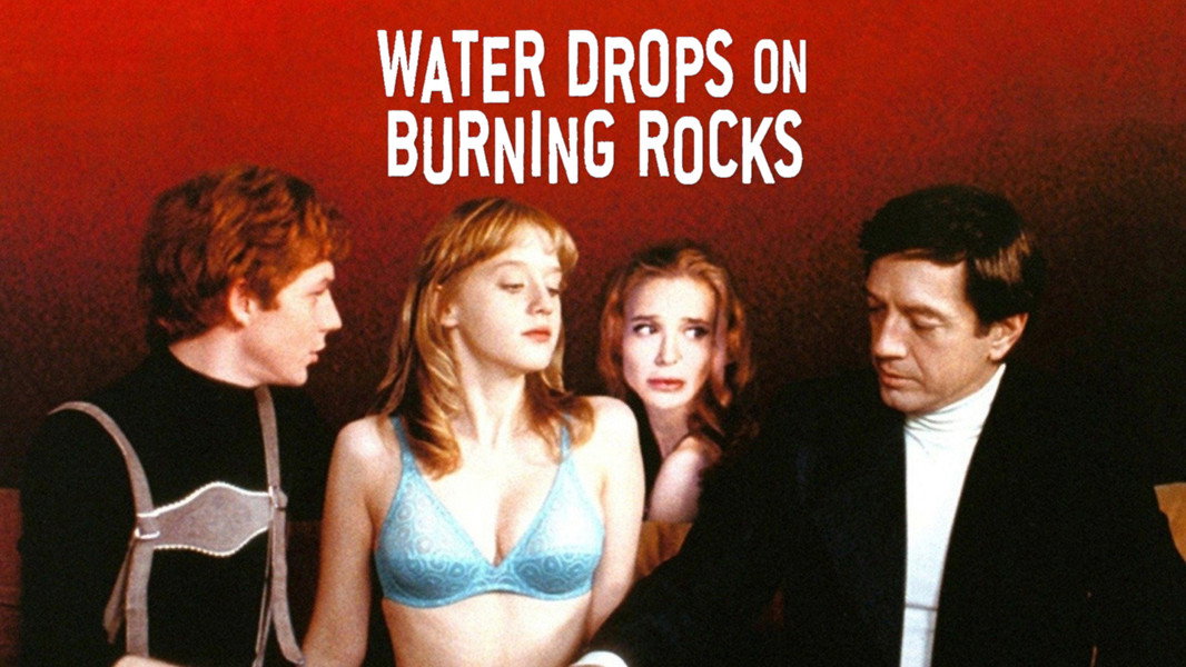 Water Drops on Burning Rocks