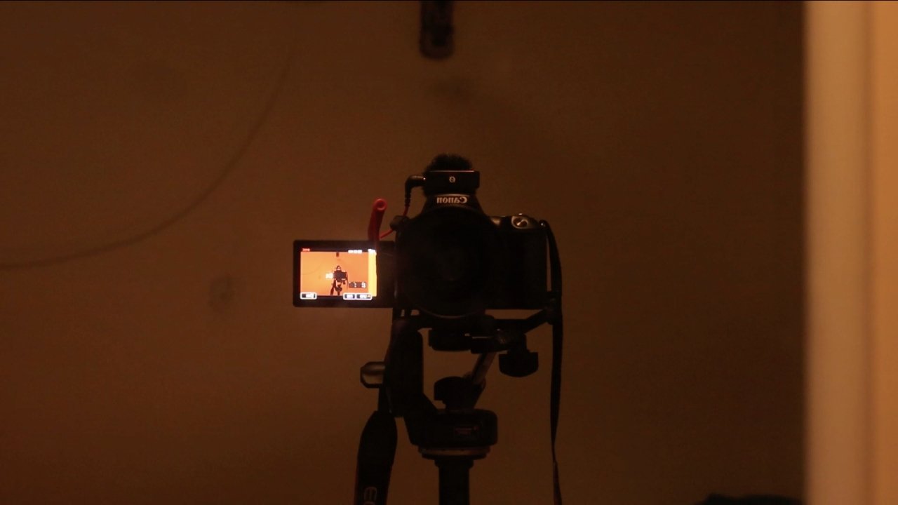 Behind backdrop