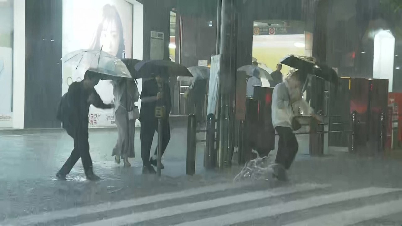 Torrential Rain Causes Flooding at Subway Station