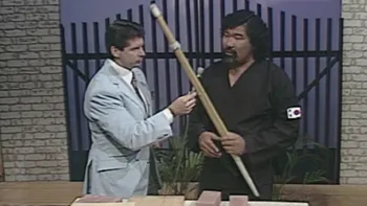 Andre the Giant sings with an oil drum band