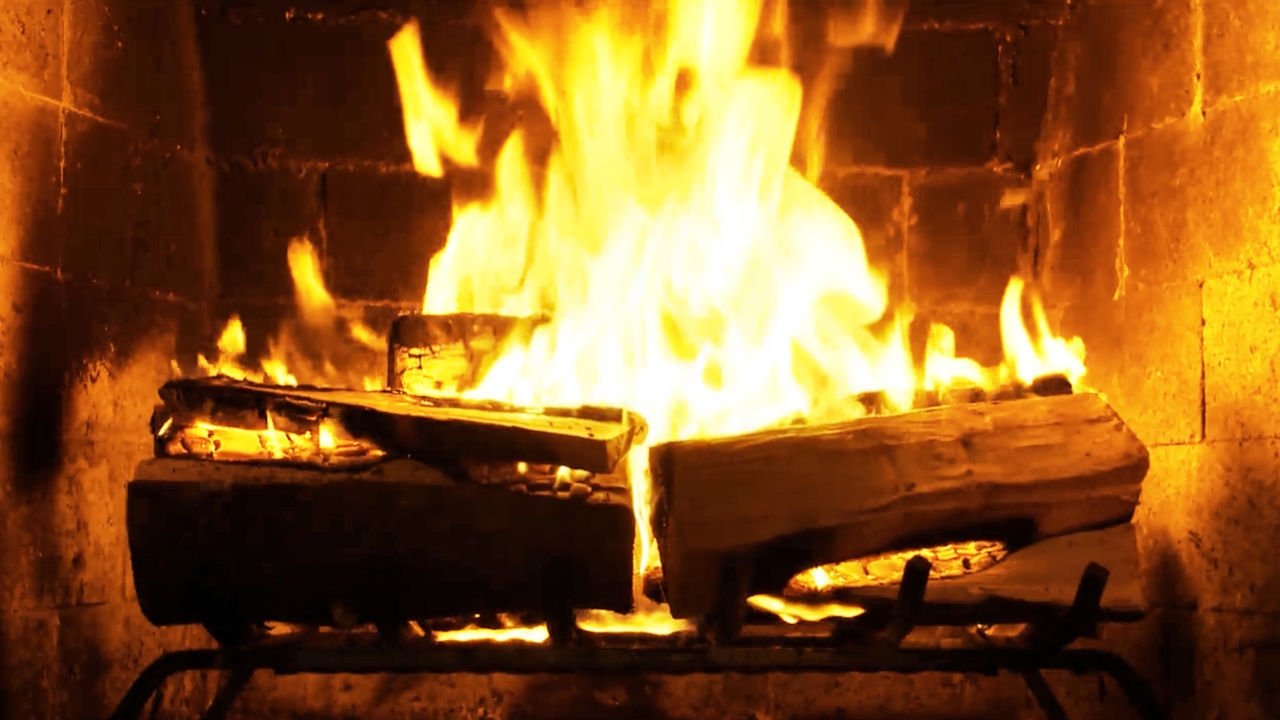 Fireplace 4K: Crackling Birchwood from Fireplace for Your Home Backdrop Image