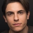 Derek Klena als DJ Fingablast