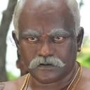 'Poo' Ram als Rajangam