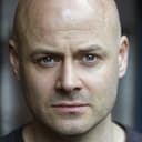 Adam McNamara als PC / Inspector MacCullen