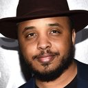 Justin Simien als Reggie Watson