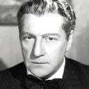 Sacha Guitry als Man Leaving Hotel in France (uncredited)