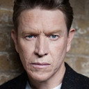 Sam Spruell als John